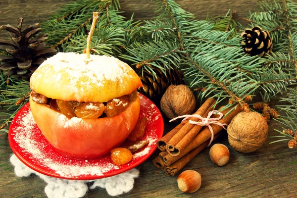 Yummy christmas apple filled with nuts, raisins and honey — Stock Photo, Image
