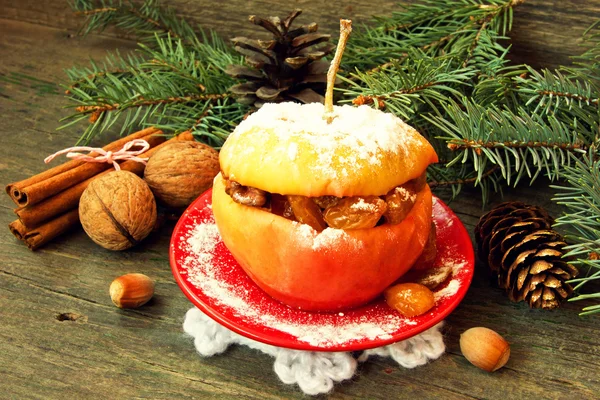 Christmas apple filled with nuts, raisins and honey — Stock Photo, Image