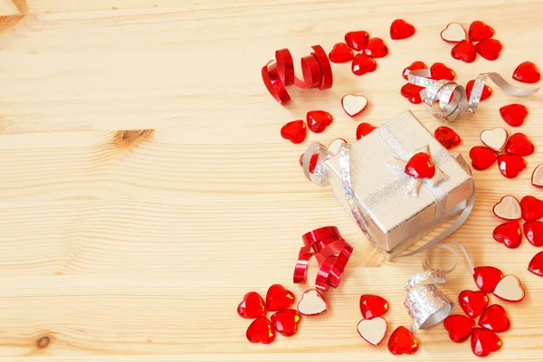 Silver gift box, ribbons, valentine's hearts — Stock Photo, Image