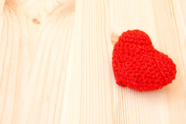Knitted red toy in the shape of heart — Stock Photo, Image