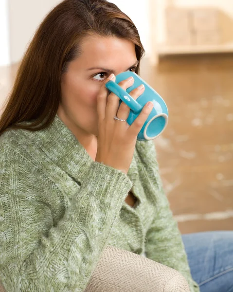 Cute Caucasian woman wearing green sweater — Stock Photo, Image