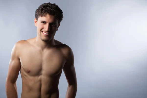 Sexy topless man with muscles in studio. — Stock Photo, Image