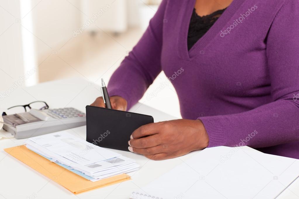 Pretty African American woman working in office