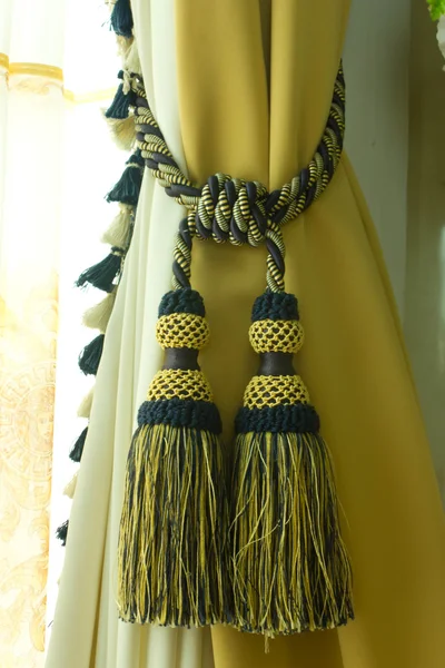 Part of luxurious window coverings of a home interior