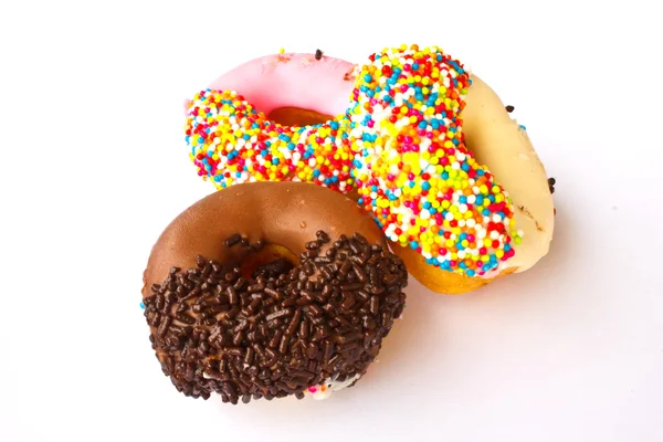 Verschiedene Donuts auf weißem Hintergrund — Stockfoto