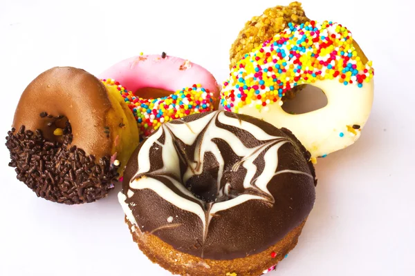 Verschiedene Donuts auf weißem Hintergrund — Stockfoto