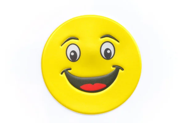 Bright, adesivo amarelo com um rosto sorridente — Fotografia de Stock