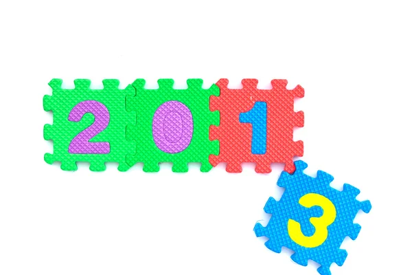 Tarjeta de Año Nuevo 2014 hecha de piezas de rompecabezas azules y rojos — Foto de Stock