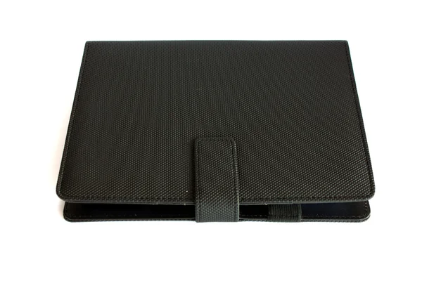 Notebook preto isolado em fundo branco, conservação concep — Fotografia de Stock