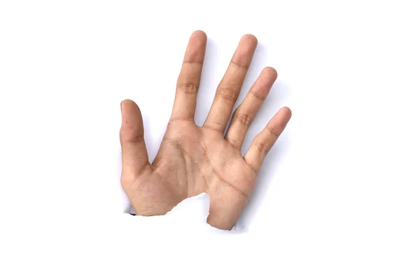 Изображение человеческой руки, протянутой через рваную бумагу — стоковое фото
