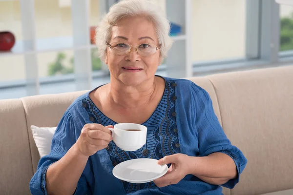 Woman with tea — Stock Photo, Image