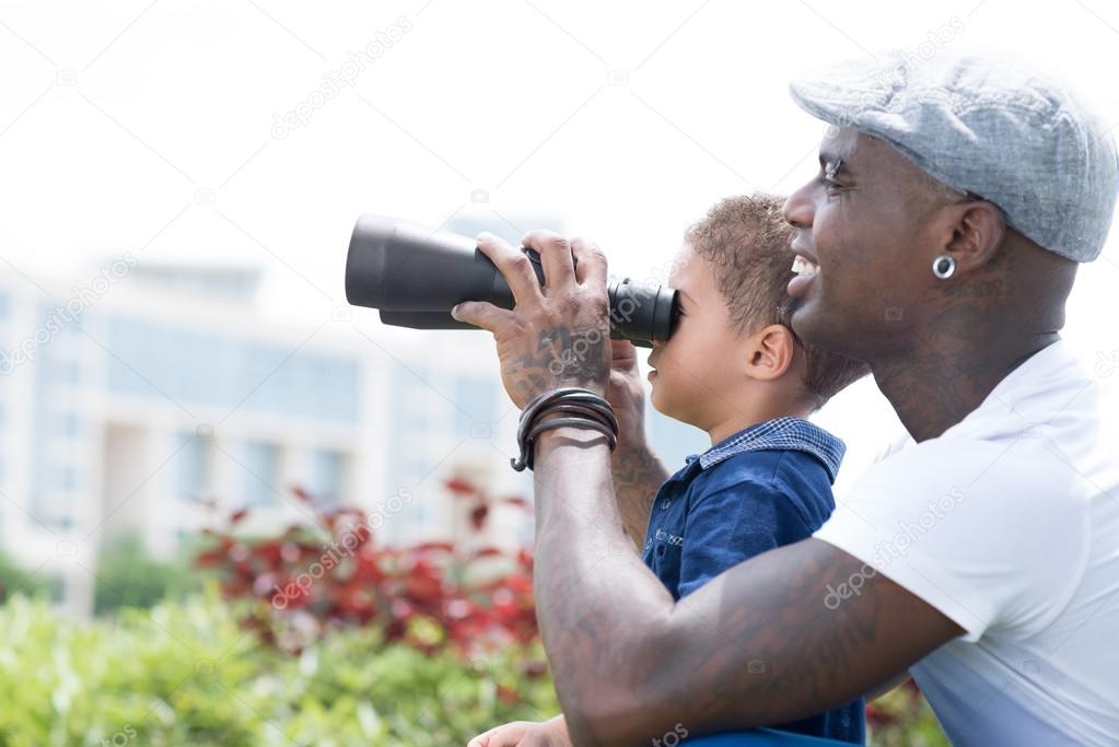 With binoculars