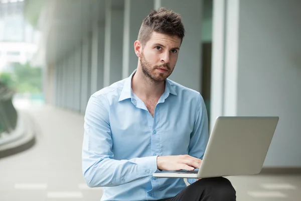 Businessman networking with computer — Stock Photo, Image