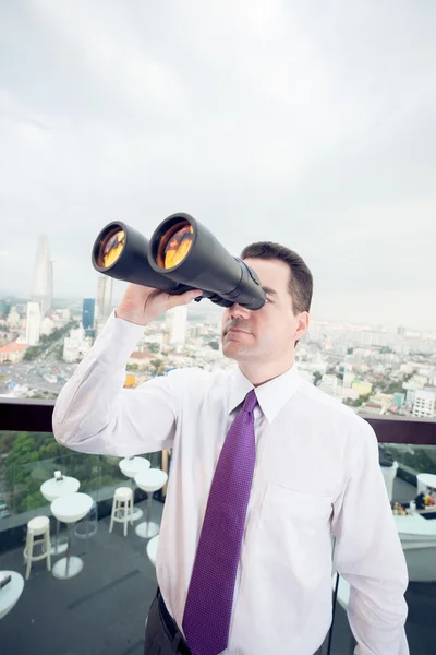 Businessman with the binoculars — Stock Photo, Image