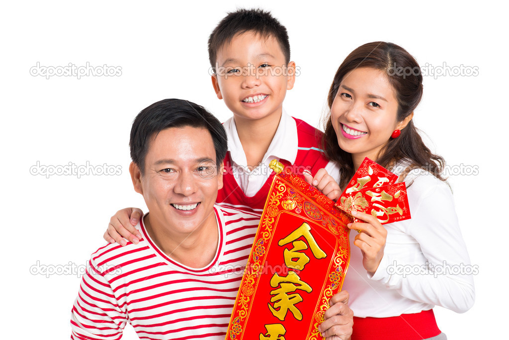 Adorable family with Tet decorations