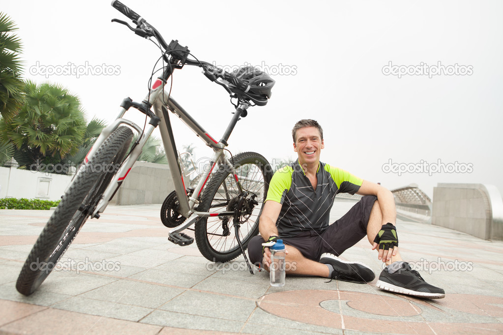 Cyclist drinking water after cycling