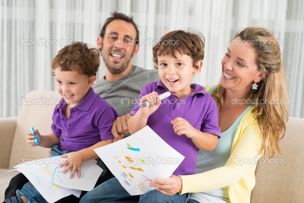 Kid drawing something with mum