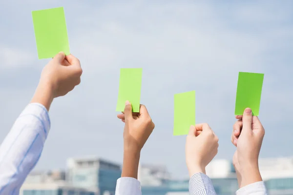 F businesspeople with cards — Stock Photo, Image