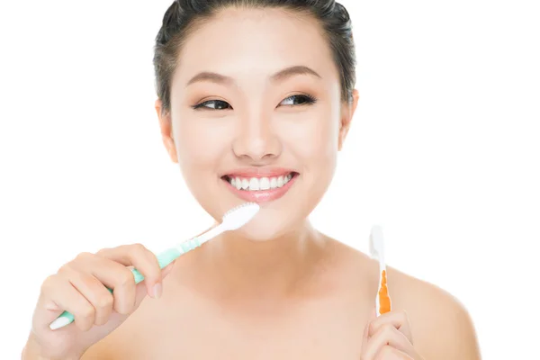 Girl with toothbrushes — Stock Photo, Image