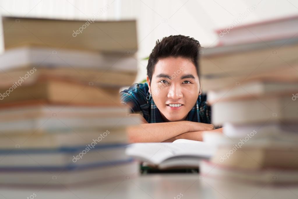 Student with books stacks