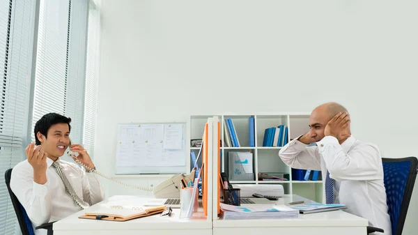 Businessman annoyed by phone — Stock Photo, Image