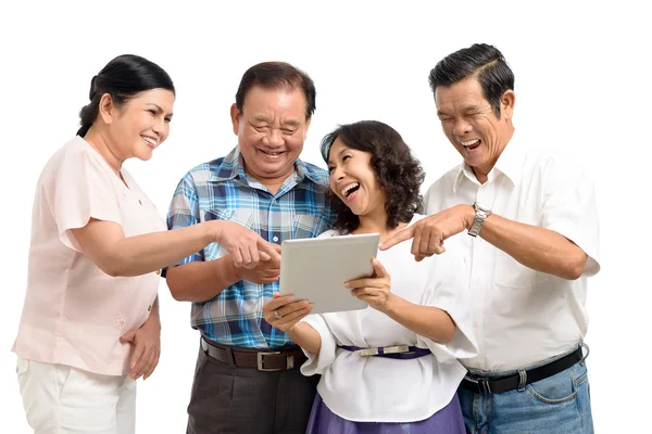 Four mature friends laughing — Stock Photo, Image