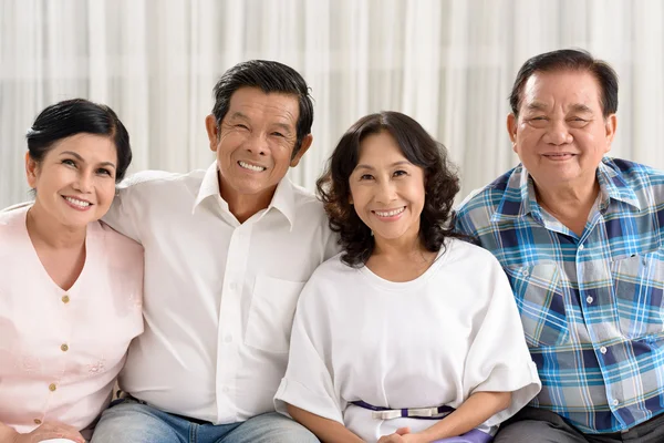 Retired people sitting on the sofa — Stock Photo, Image