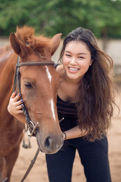 Girl hugging a pony — Stock Photo, Image