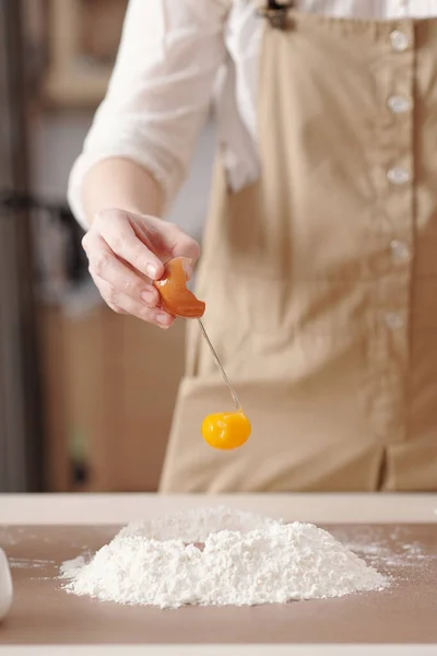 Woman Mixing Egg Yolk with Flour — Stock Photo, Image