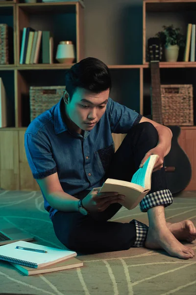 Young Asian Man Reading Textbook — Stock Photo, Image