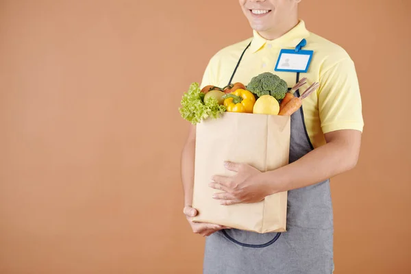 Paquete de retención de trabajador de tienda de comestibles —  Fotos de Stock