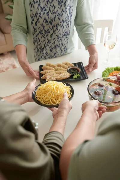 Women Putting Homemade Dishes on Table — Fotografia de Stock