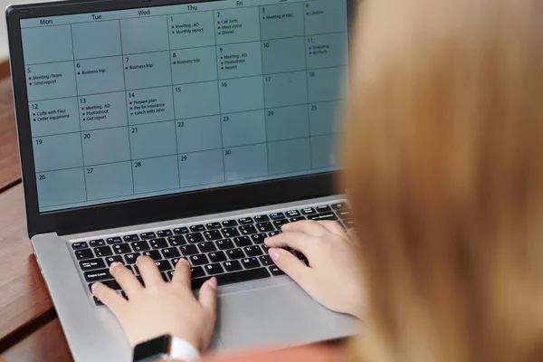 Entrepreneur Filling Calendar on Laptop — Fotografia de Stock