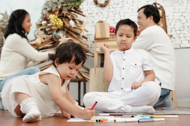 Siblings Drawing Christmas Pictures