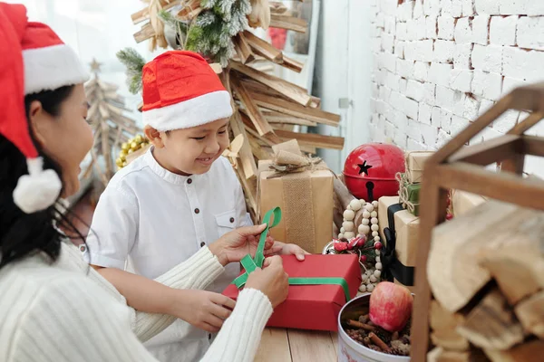 Boy Enjoying Wrapping Christmas Presents — Stock Photo, Image