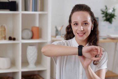 Woman Setting Alarm on Smartwatch