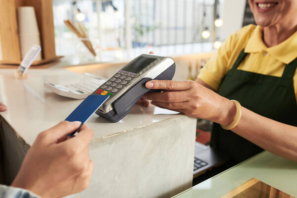 Cafe Worker Accepting Payment