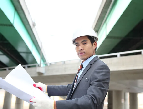 Young architect with blueprint — Stock Photo, Image