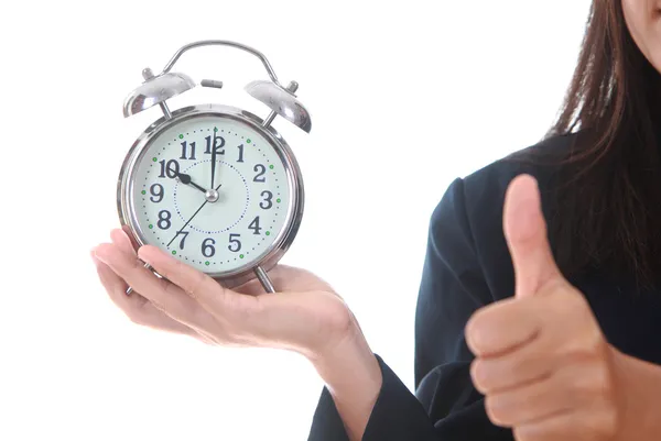 Copy space an alarm clock with woman hand showing succes sign — Stock Photo, Image