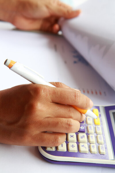 Business concept hand analyzing financial data Stock Photo
