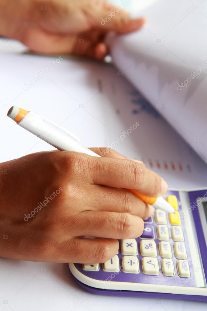 Business concept hand analyzing financial data