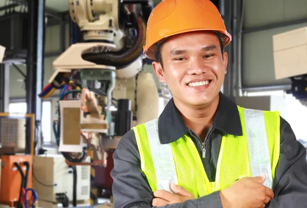 Man factory engineer or worker with robot machine — Stock Photo, Image
