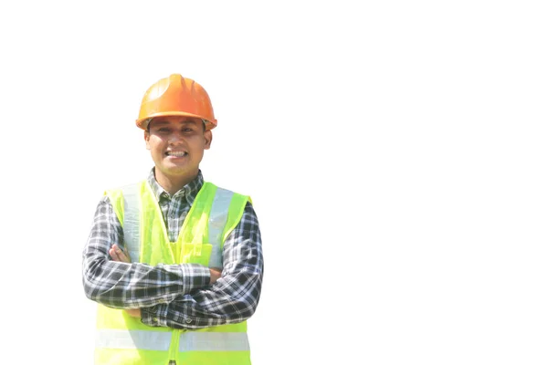 カメラの向こうに白い背景とデザインのための空間を見て笑顔で手を渡って立つ建設労働者 ストック画像