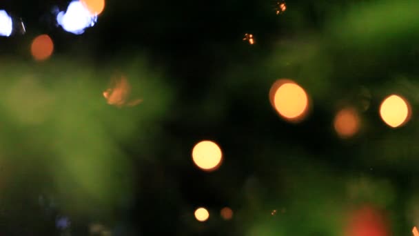 Colored lights effects, Christmas tree background — Stock Video
