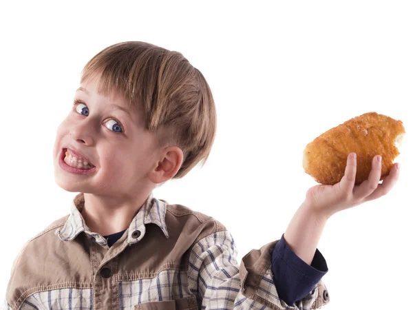 Junge isst Donut — Stockfoto