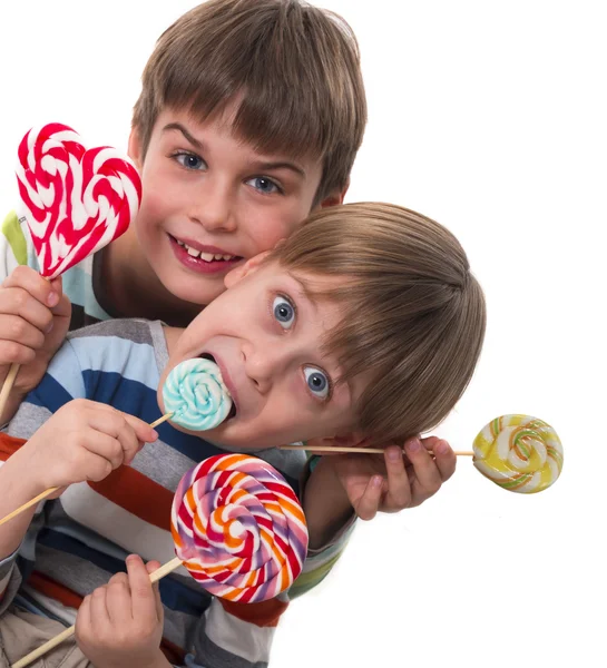 Happy boys with lollipops — Stock Photo, Image