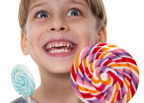 Niño feliz con piruletas —  Fotos de Stock