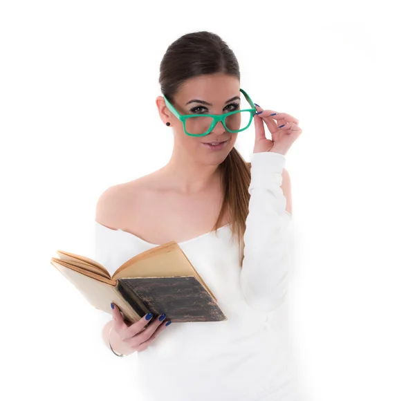 Young woman with green glasses read a book, studio shot — Stock Photo, Image