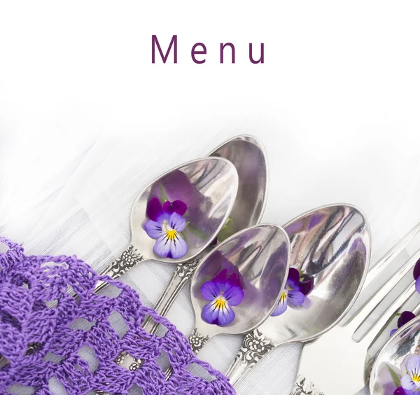 Silverware with violets — Stock Photo, Image