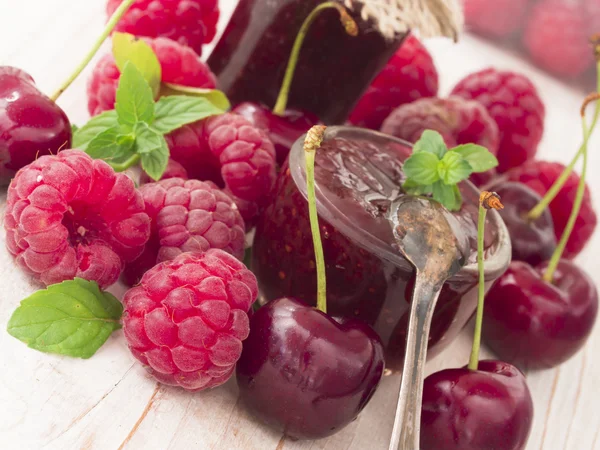 Jam made of raspberries and cherries — Stock Photo, Image